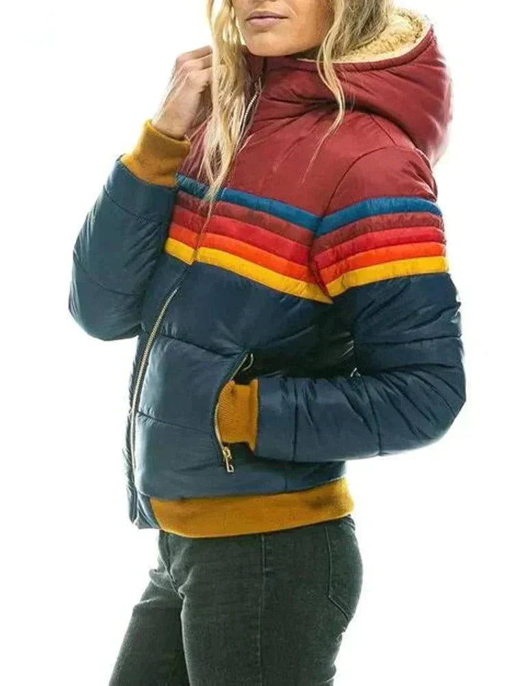 Multicolored puffer jacket with a striped pattern worn by a person on a white background