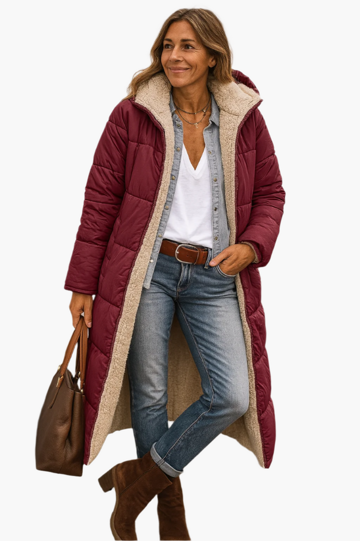 Adeline hooded longline puffer jacket in burgundy, front view with handbag