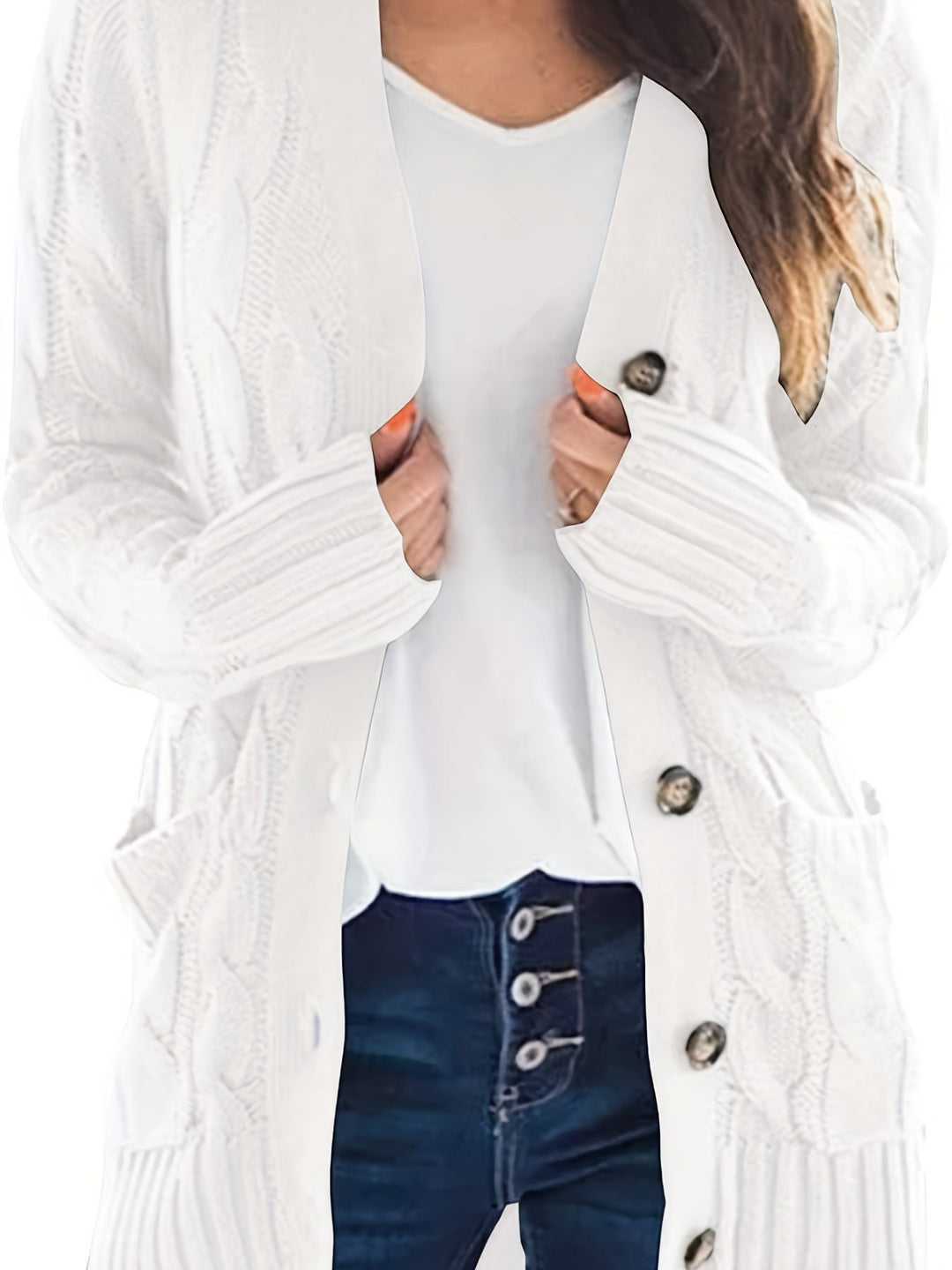 Delphine cable knit cardigan in white, front view showing buttons and pockets