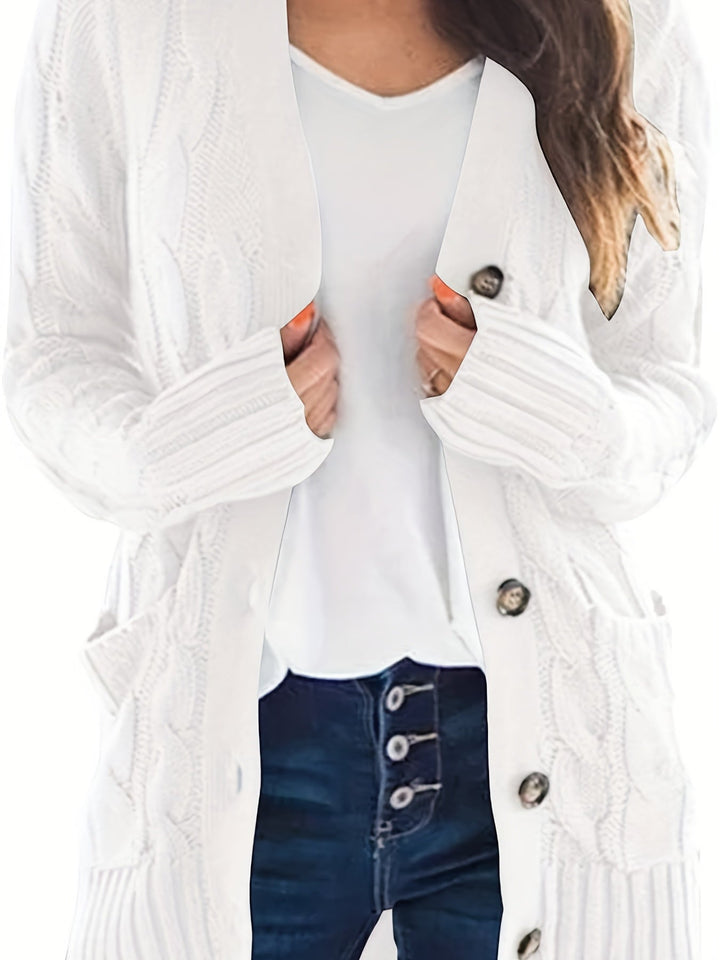 Delphine cable knit cardigan in white, front view showing buttons and pockets