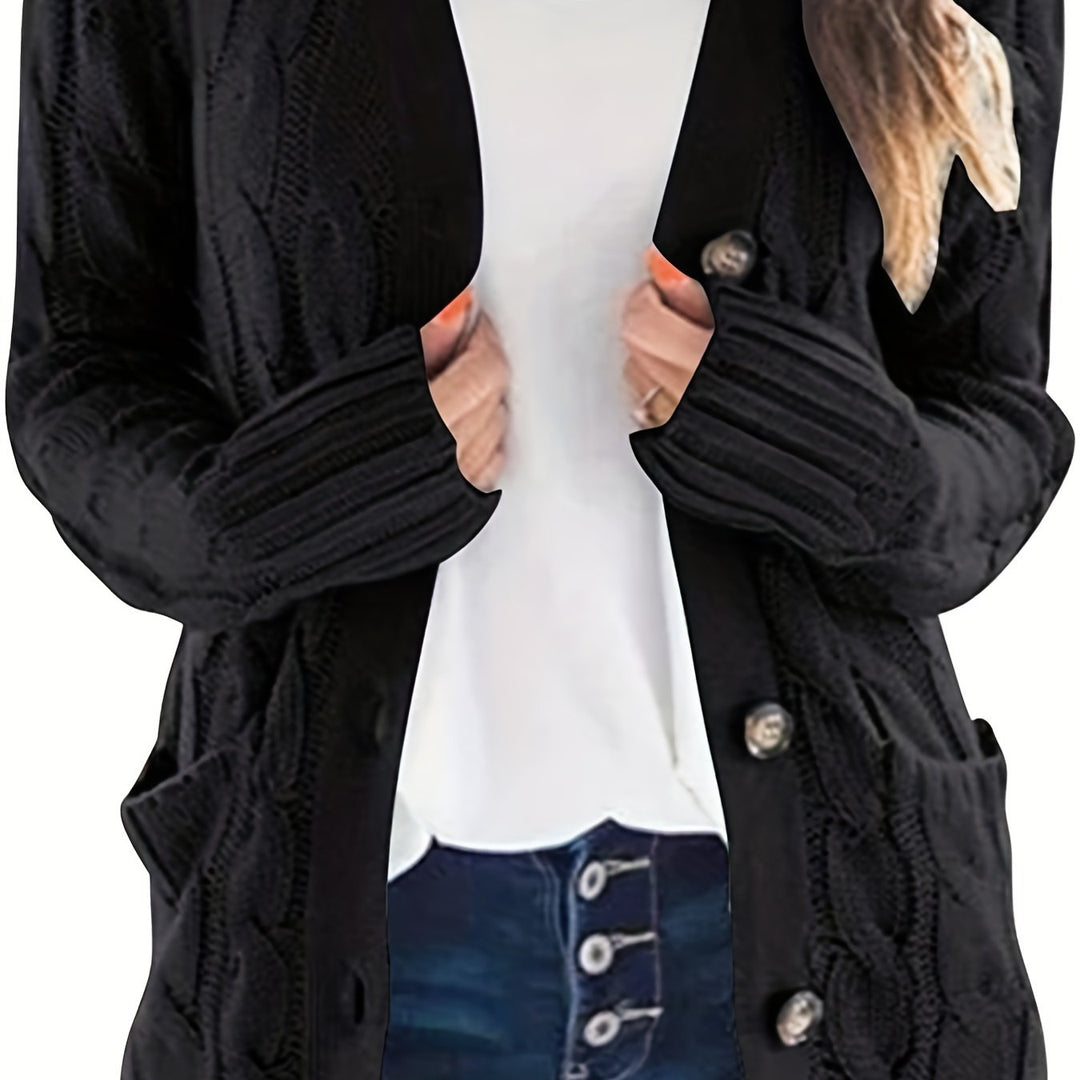 Delphine cable knit cardigan in black, front view close-up on buttons and cuffs