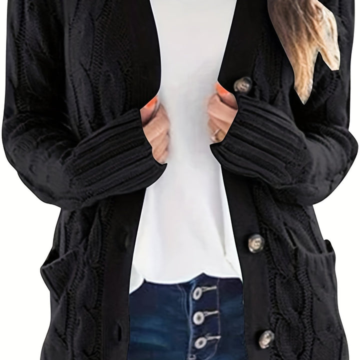 Delphine cable knit cardigan in black, front view close-up on buttons and cuffs