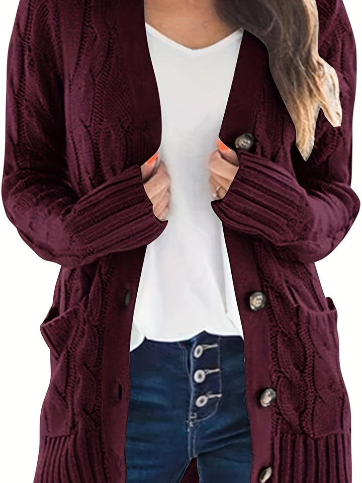 Delphine cable knit cardigan in burgundy, front view with hands on lapels