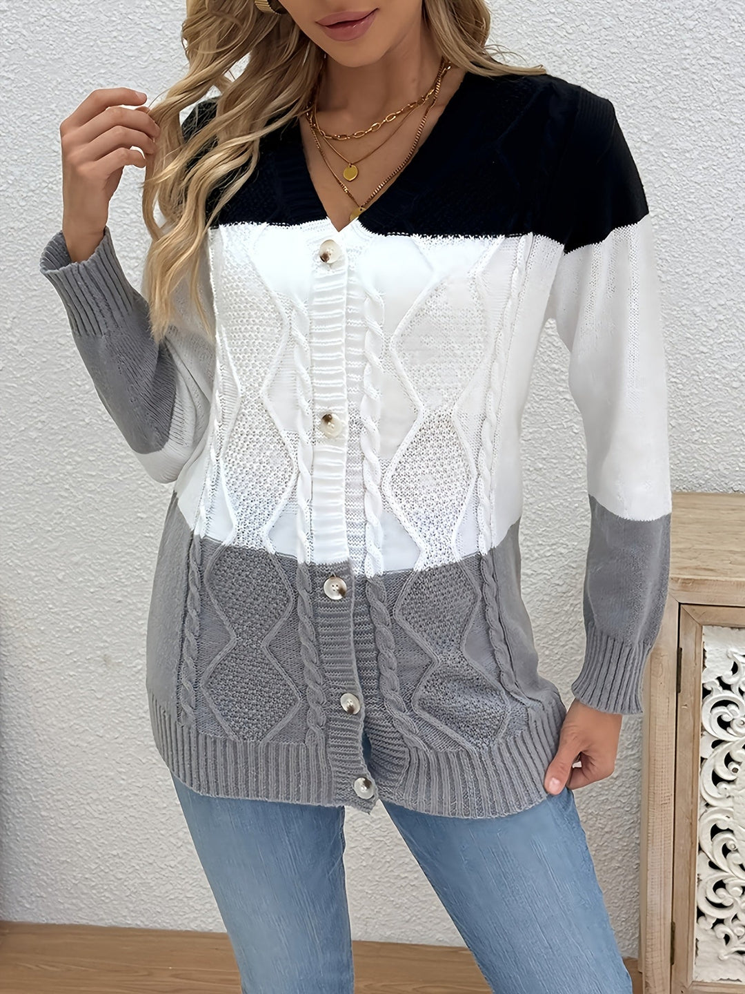 Delphine pink colorblock cable knit cardigan, front view with bag