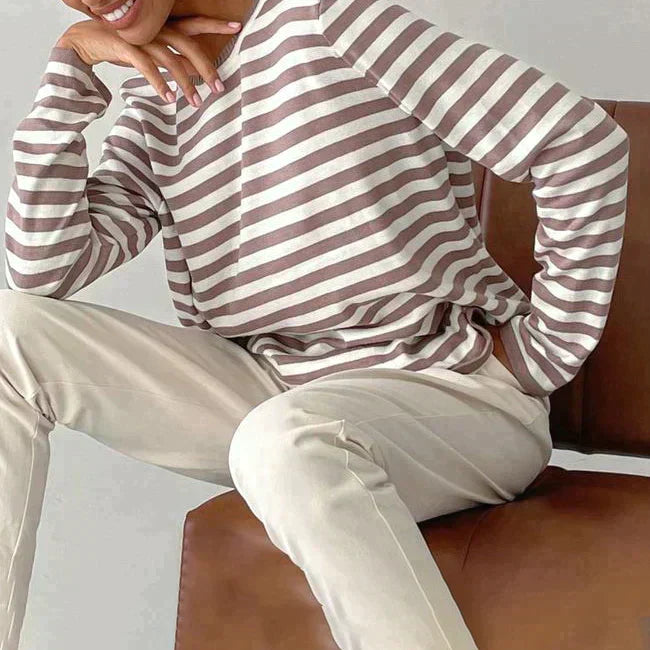 Delphine striped crew neck sweatshirt in taupe and white, styled seated pose