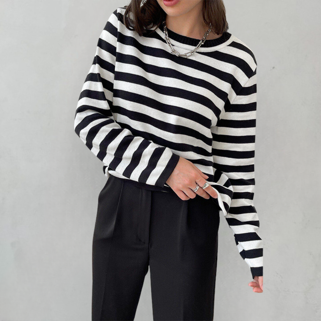 Delphine striped crew neck sweatshirt in black and white, styled with tailored pants