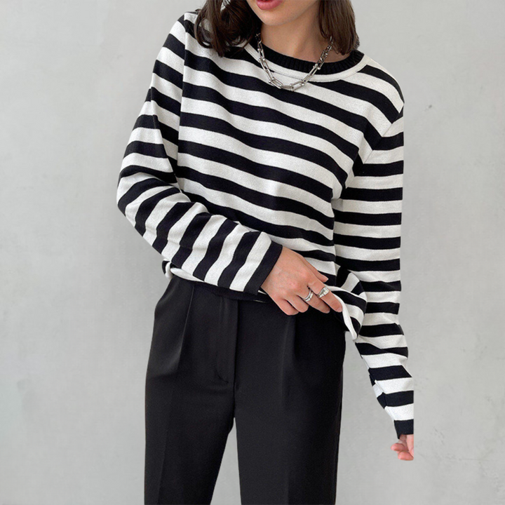 Delphine striped crew neck sweatshirt in black and white, styled with tailored pants