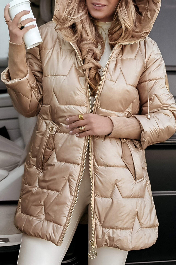 Eleanor hooded quilted puffer coat in beige, close-up sleeve badge detail