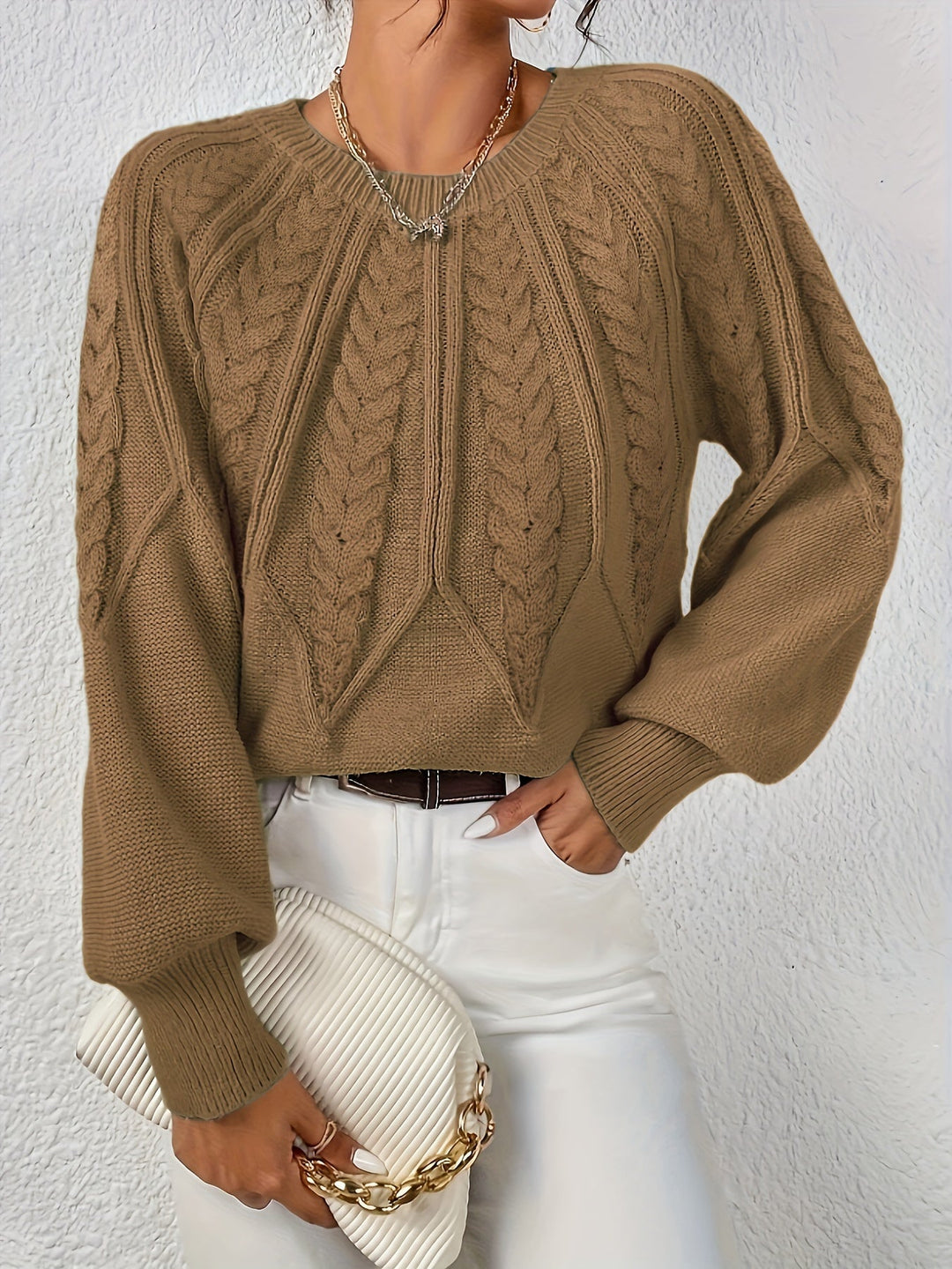 Elowen camel cable-knit round-neck sweater, front view with handbag