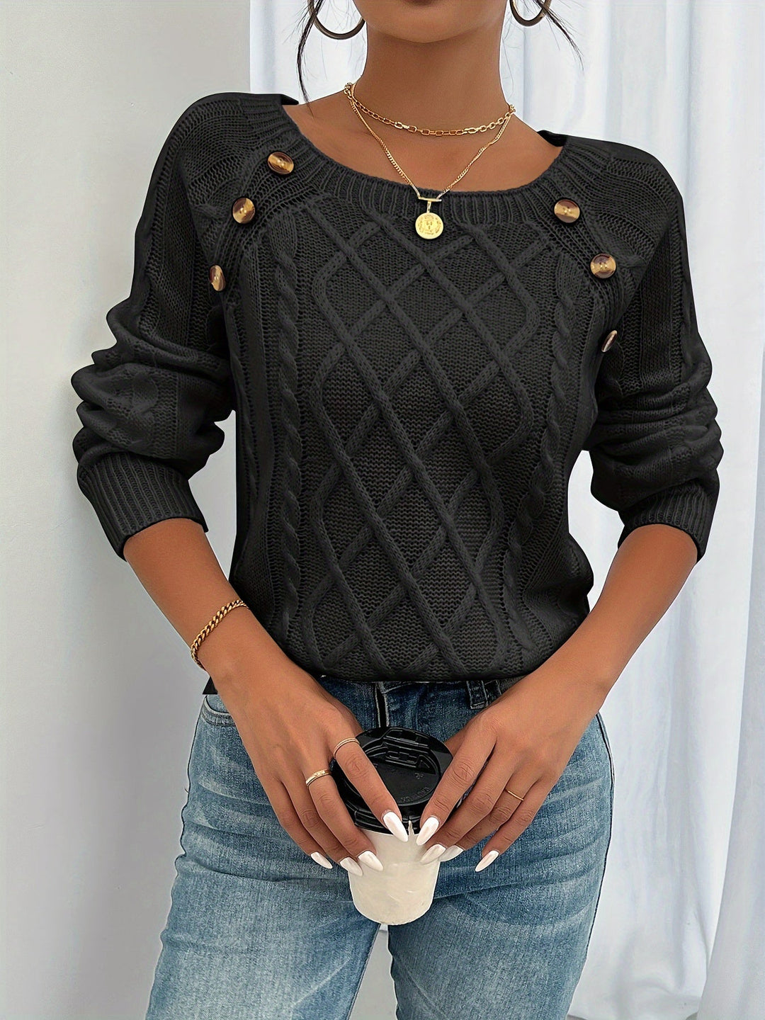Estelle cable knit button detail sweater in black, front view