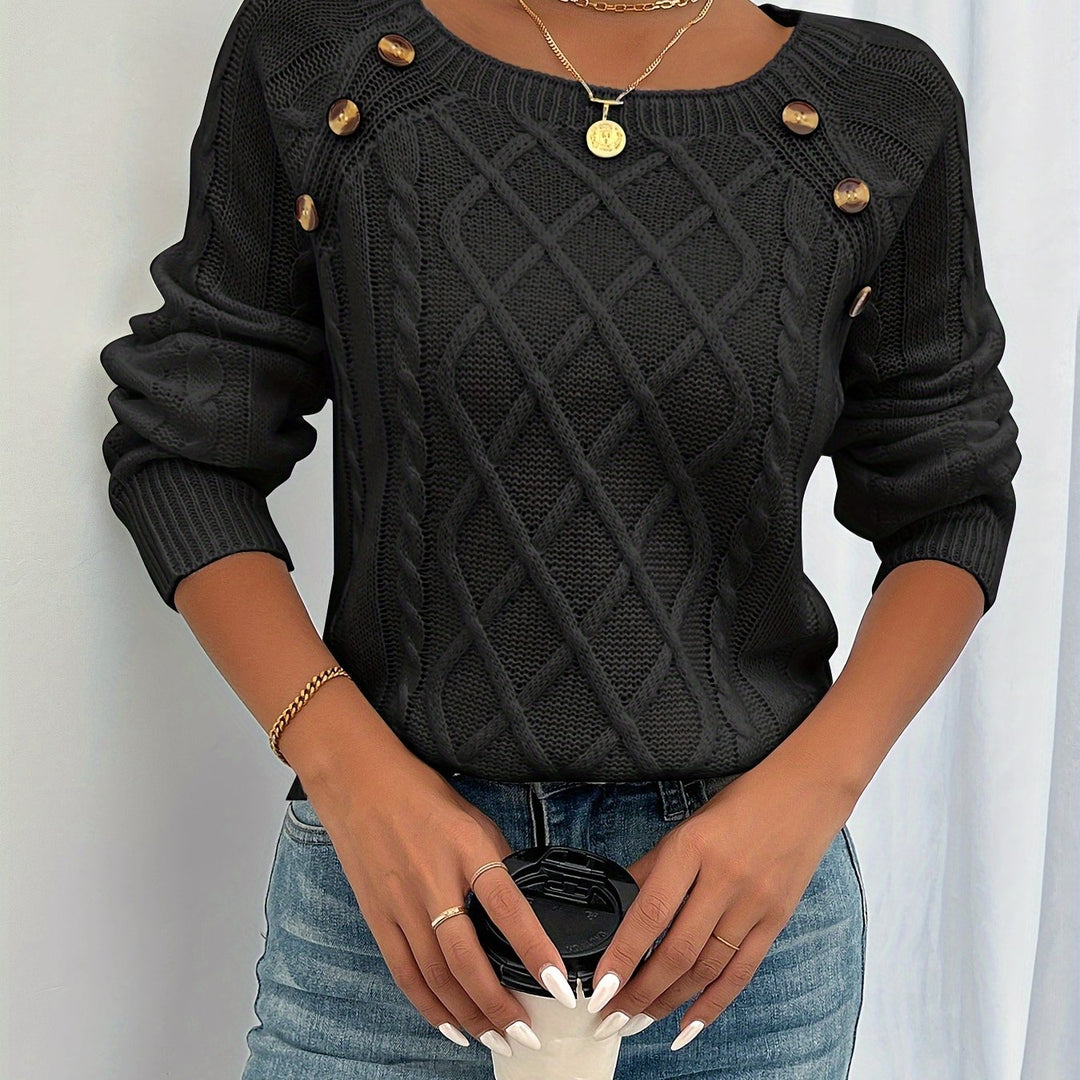 Estelle cable knit button detail sweater in black, close-up front view
