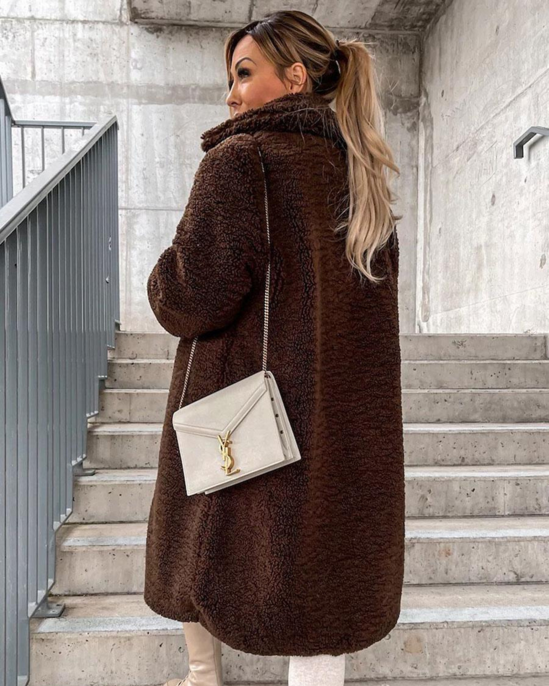 Everly dark brown teddy coat back view with crossbody bag