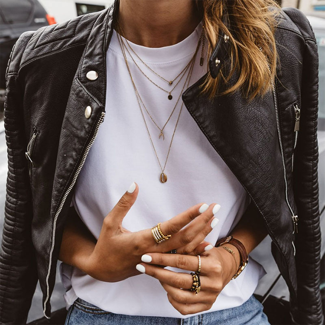 Genevieve quilted faux leather biker jacket layered over a white tee, close-up front view