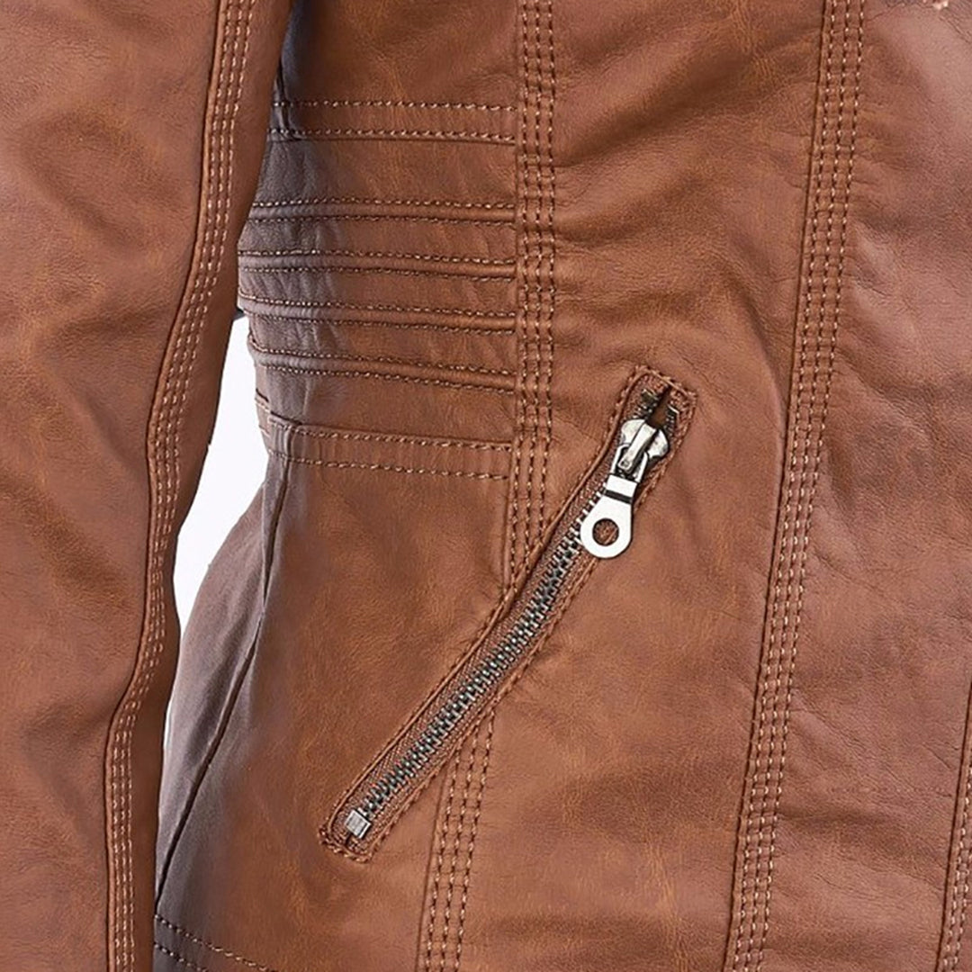 Close-up of zip pocket and stitching detail on Giselle faux leather jacket