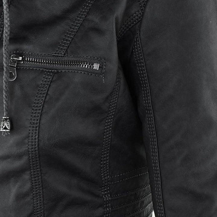 Close-up of zip pocket detail on Giselle black faux leather jacket