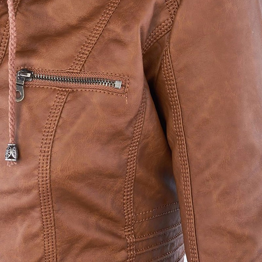 Close-up of zip pocket detail on Giselle faux leather jacket