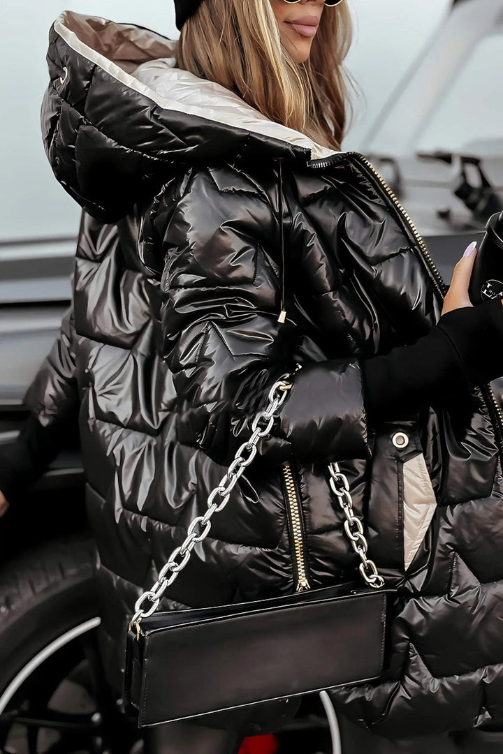 Harlow hooded puffer jacket in black, close-up of quilted texture and chain-strap bag