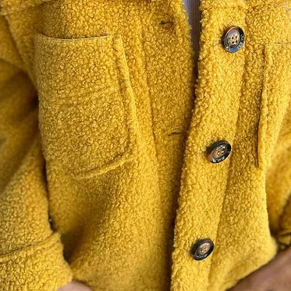 Harlow teddy coat pocket and button detail close-up