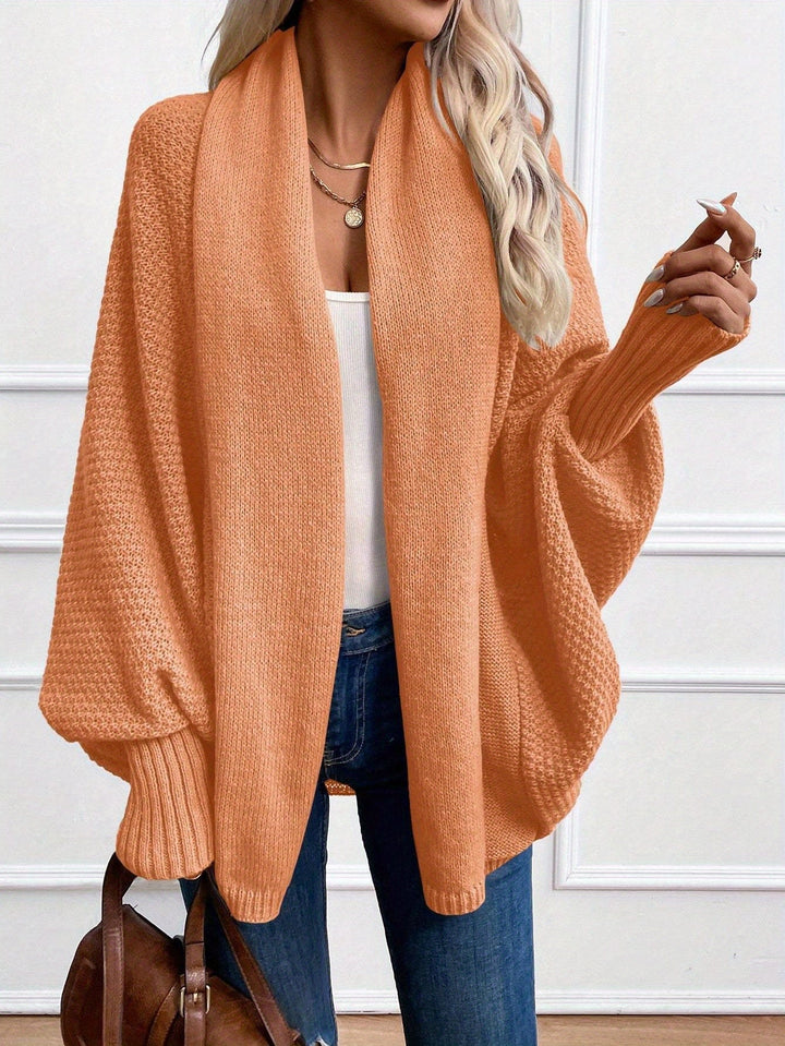 Harlow draped shawl collar cardigan in orange, front view