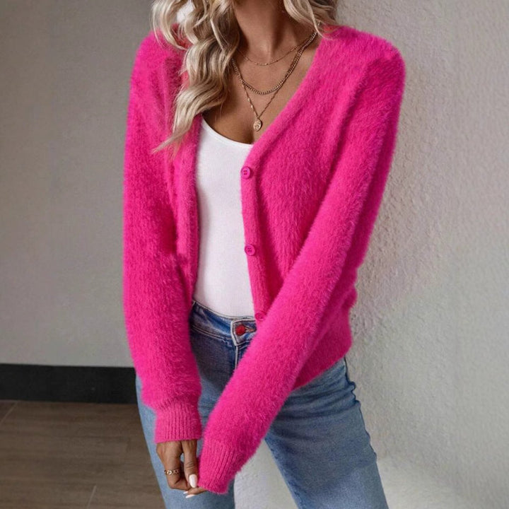 Harlow fuzzy pink cardigan, holding coffee cup, front view