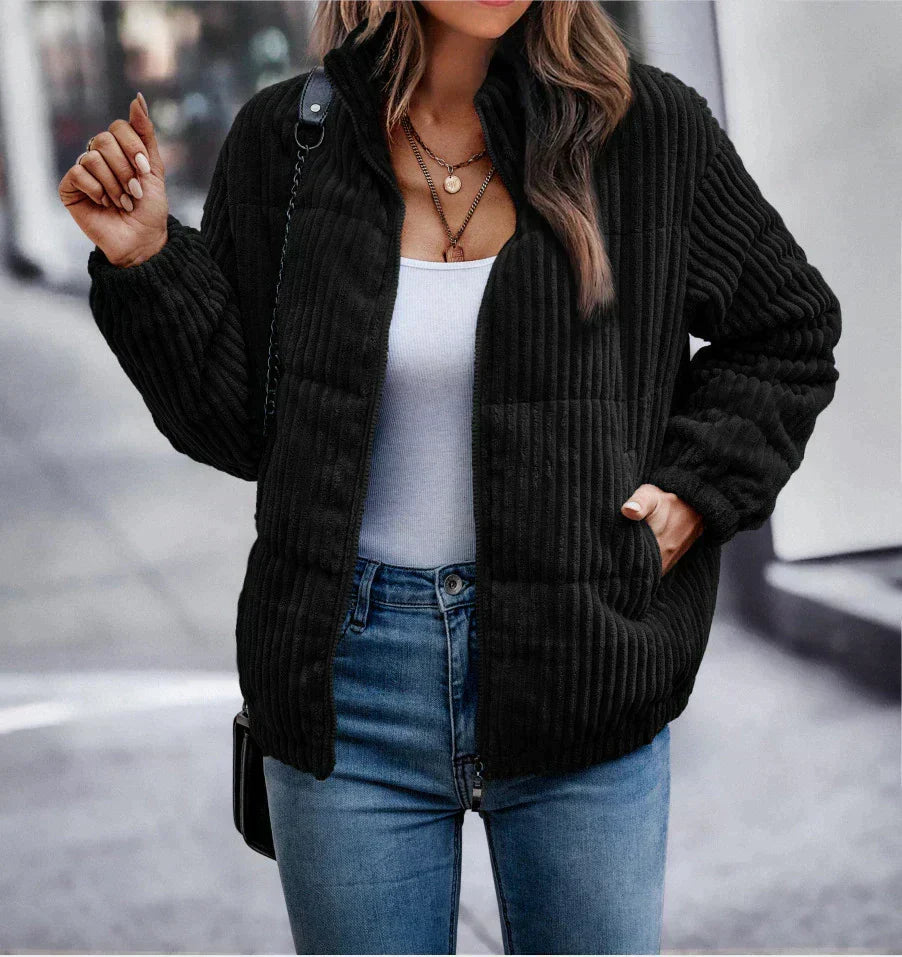 Harlow ribbed puffer jacket in black, front view with hand in pocket