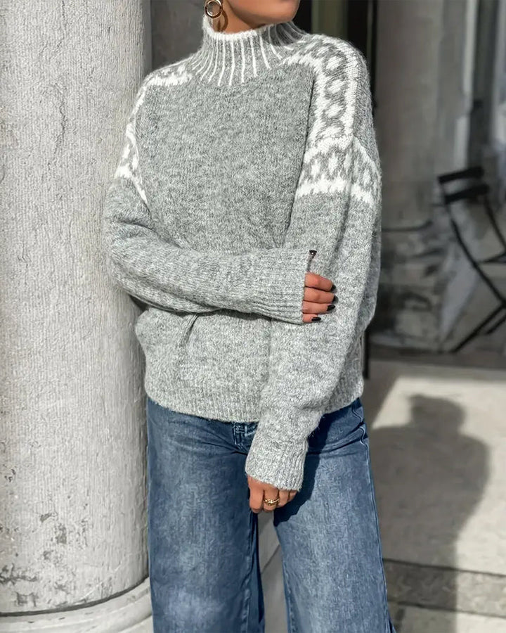 Isla Fair Isle mock neck sweater in gray, arms crossed view