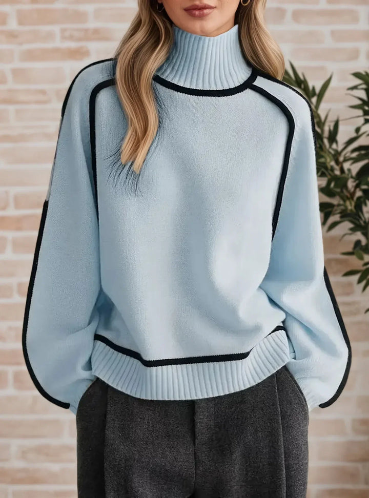 Isolde light blue turtleneck sweater with contrast piping, close-up front view