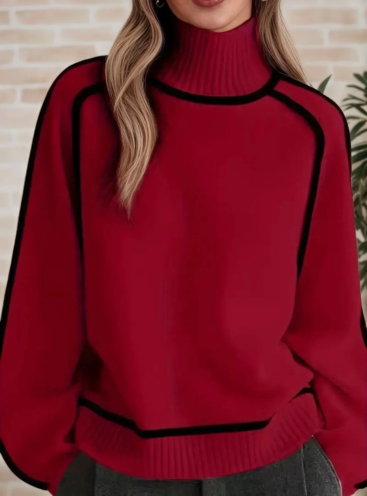 Isolde red turtleneck sweater with contrast trim, close-up front view