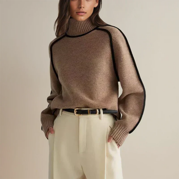 Isolde brown turtleneck sweater with contrast piping, styled with belt