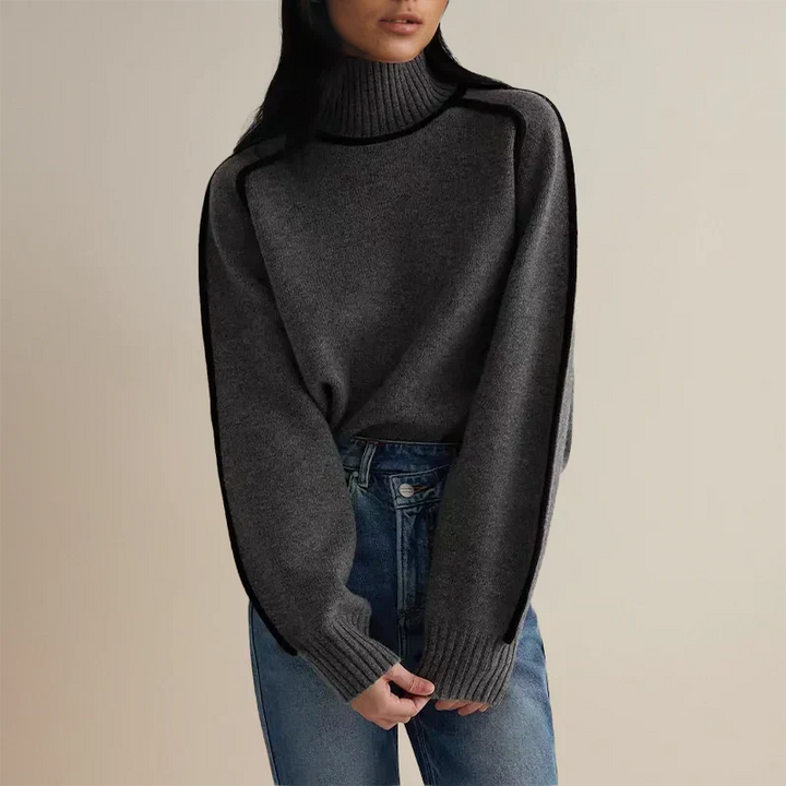 Isolde gray turtleneck sweater with contrast piping, front view with jeans