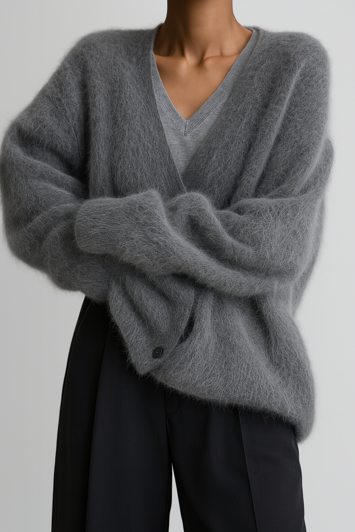 Juliette fuzzy V-neck cardigan in charcoal gray with arms crossed, front view