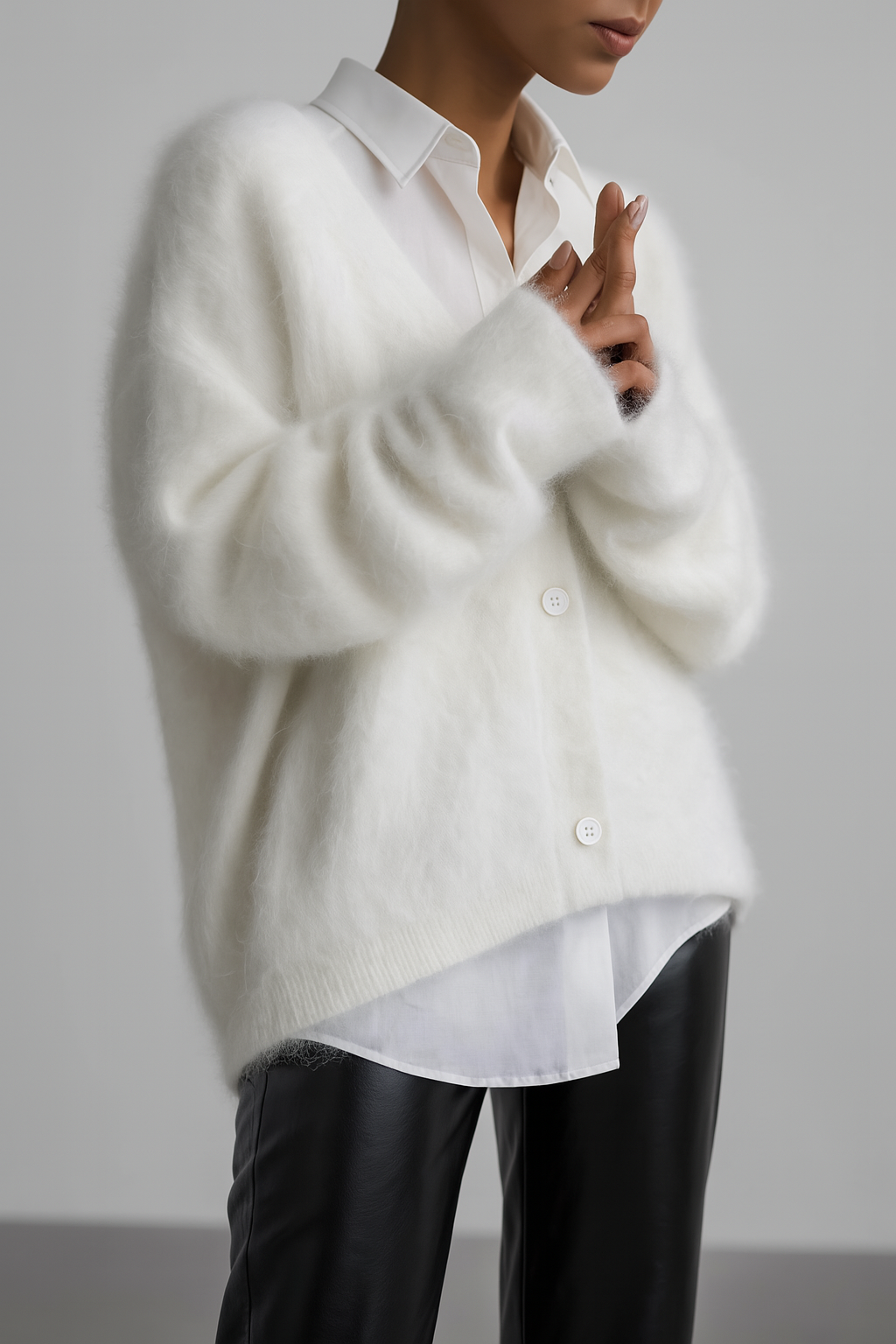Juliette fuzzy V-neck button down cardigan in ivory, layered over a white shirt
