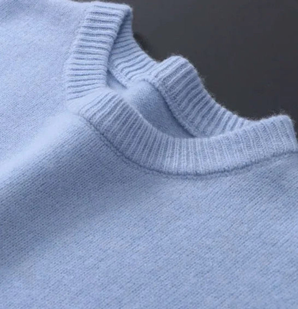 Close-up of ribbed crew neckline detail on Leonard knit sweater