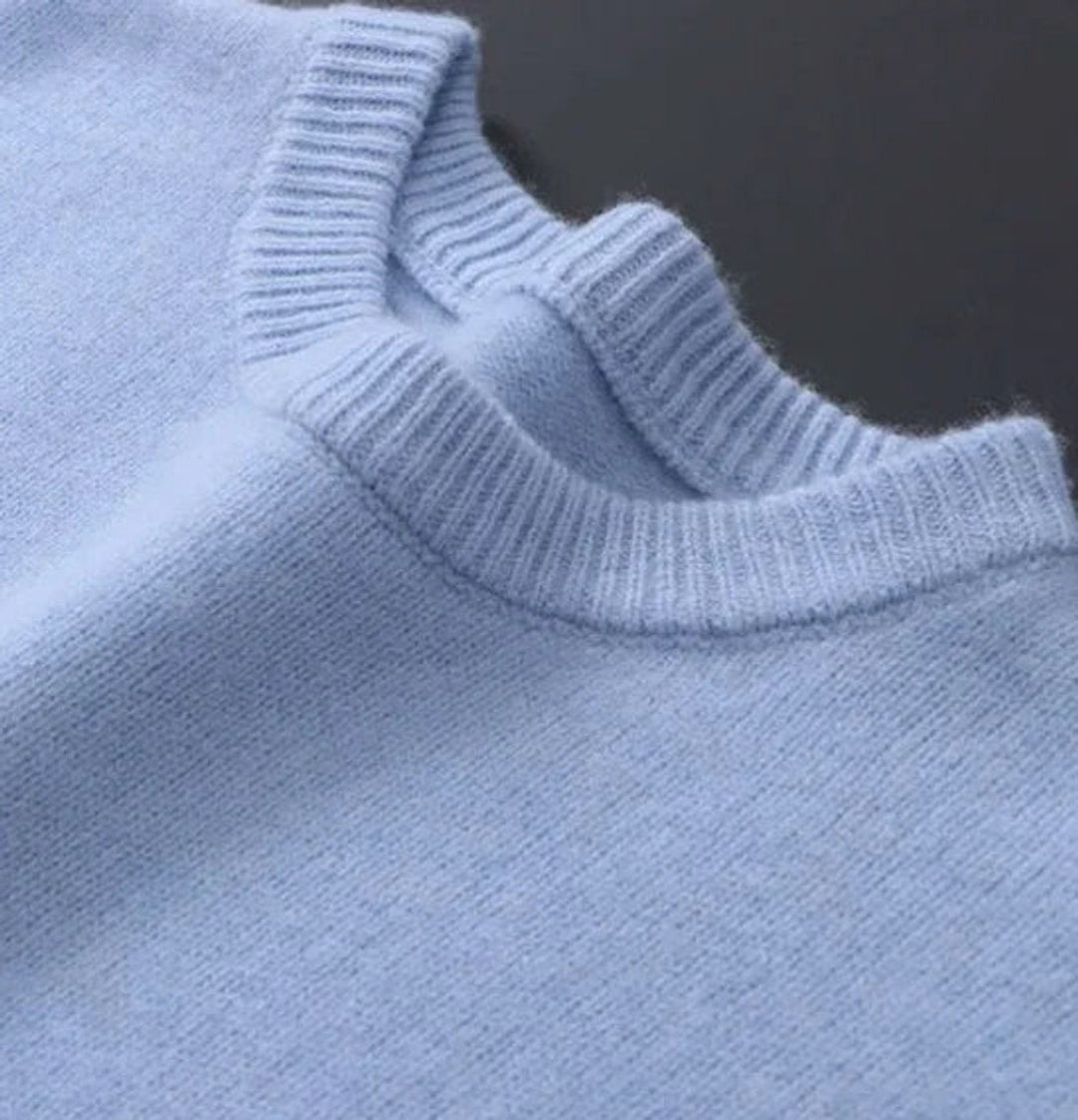 Close-up of ribbed crew neckline detail on Leonard knit sweater