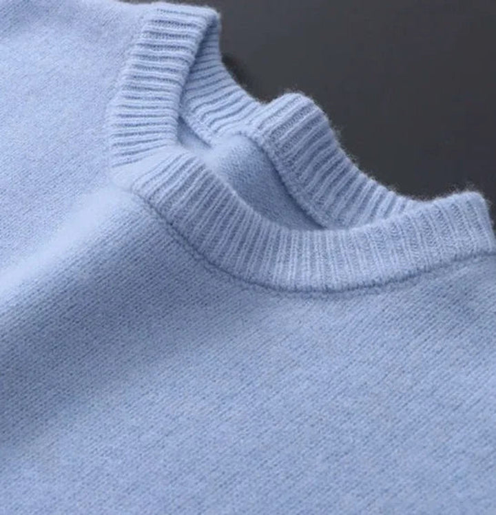 Close-up of ribbed crew neckline detail on Leonard knit sweater