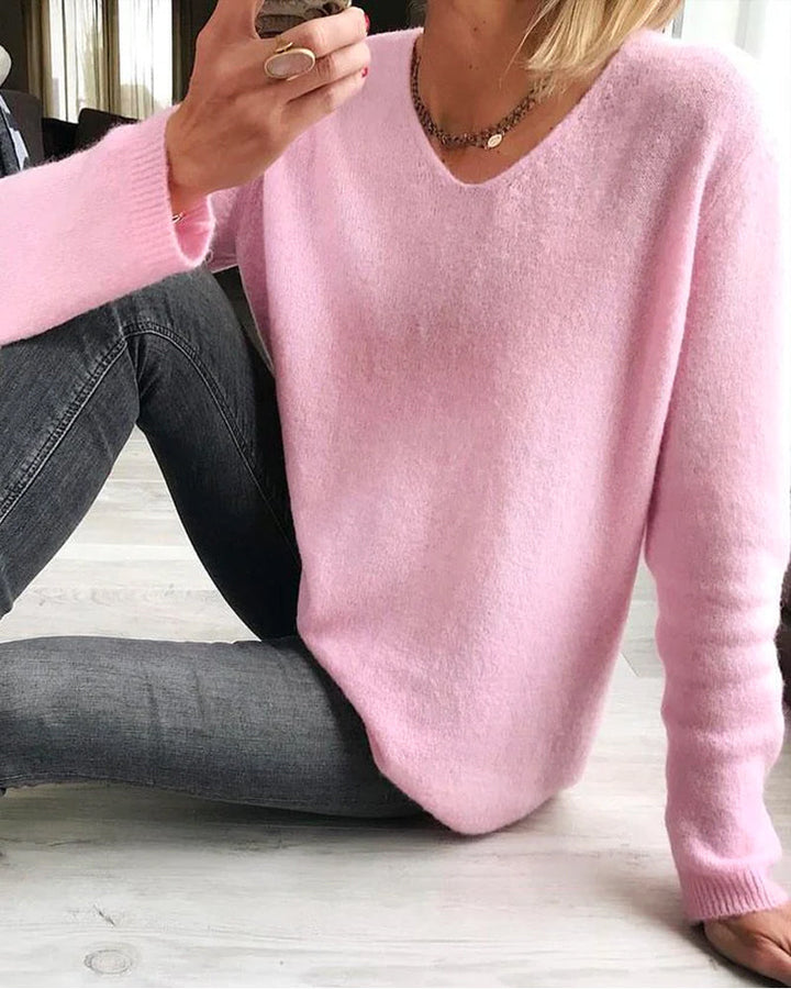 Margot v-neck long sleeve sweater in pink, seated pose