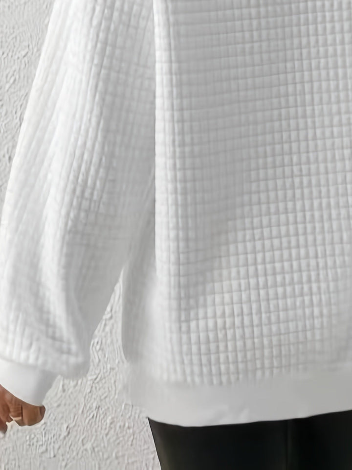 Marguerite white textured quarter-zip pullover, close-up of sleeve and hem texture
