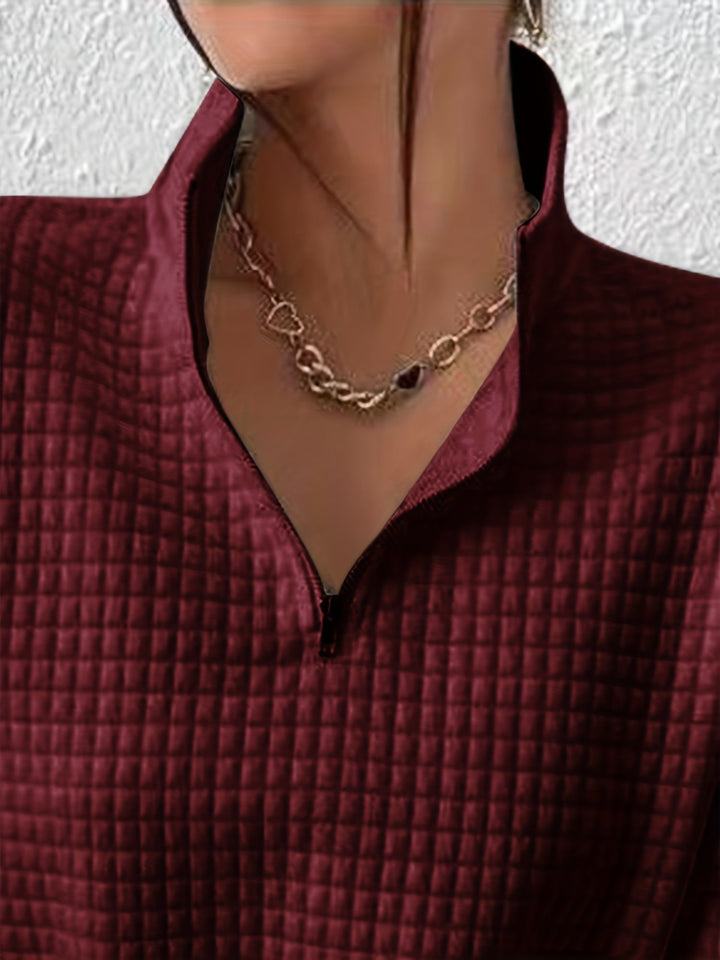 Marguerite deep red textured quarter-zip pullover, close-up of collar and zip