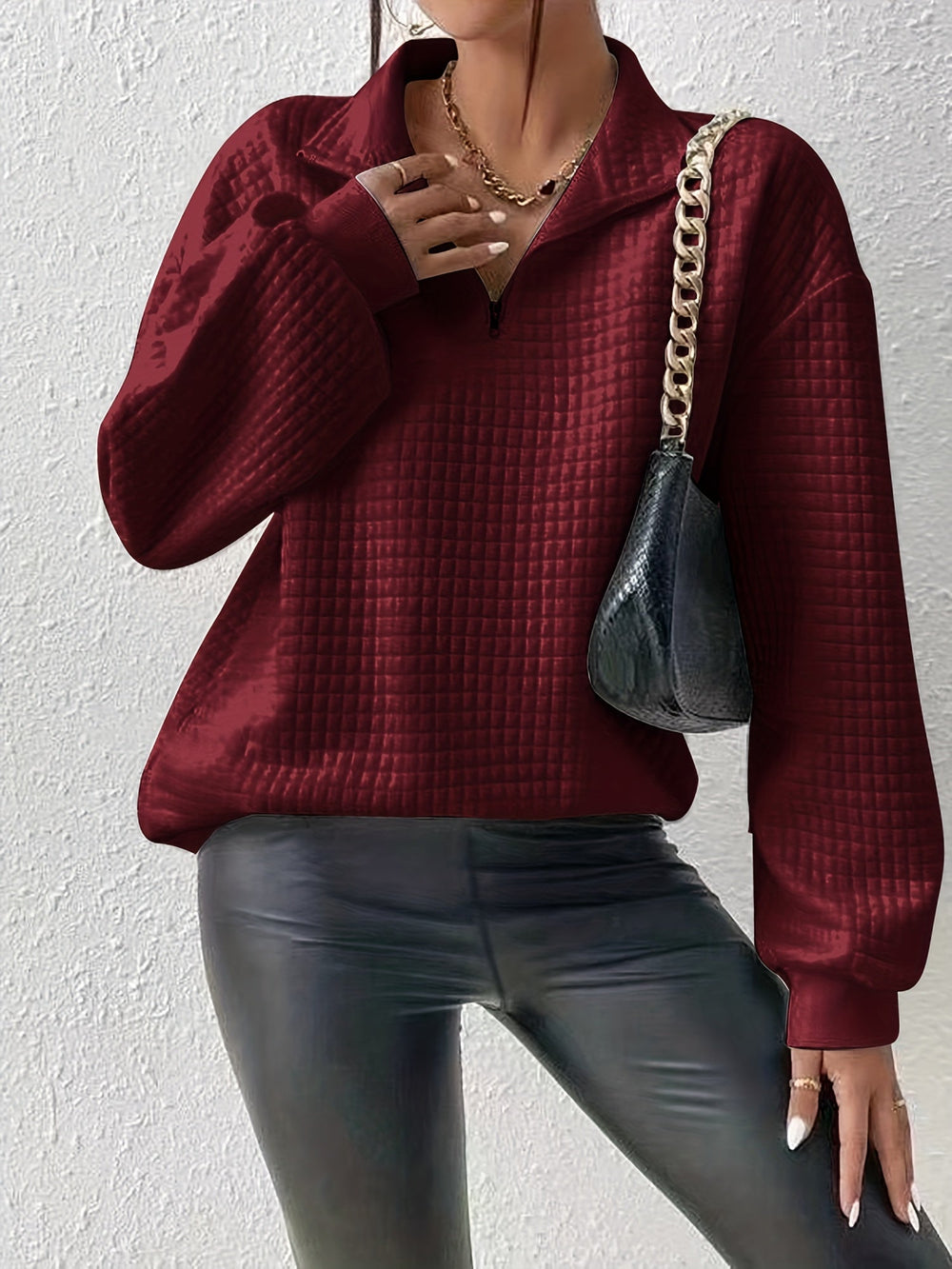 Marguerite deep red textured quarter-zip pullover styled with black pants