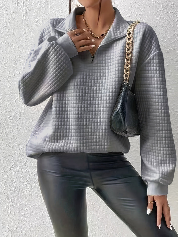 Marguerite grey textured quarter-zip pullover styled with black pants