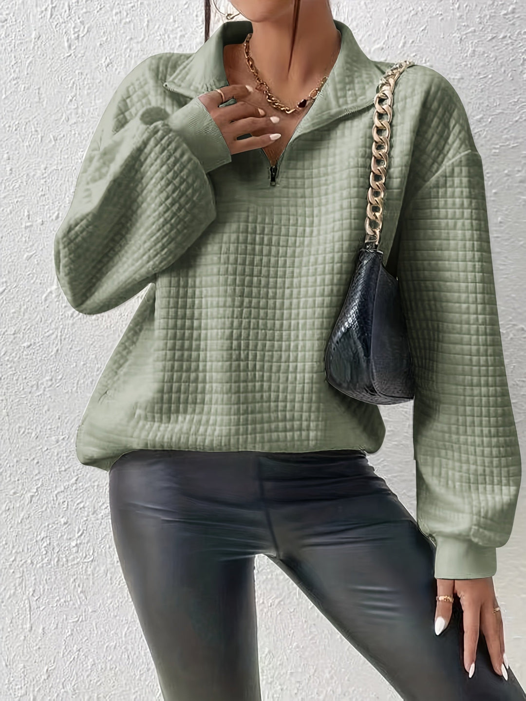 Marguerite matcha green textured quarter-zip pullover styled with black pants