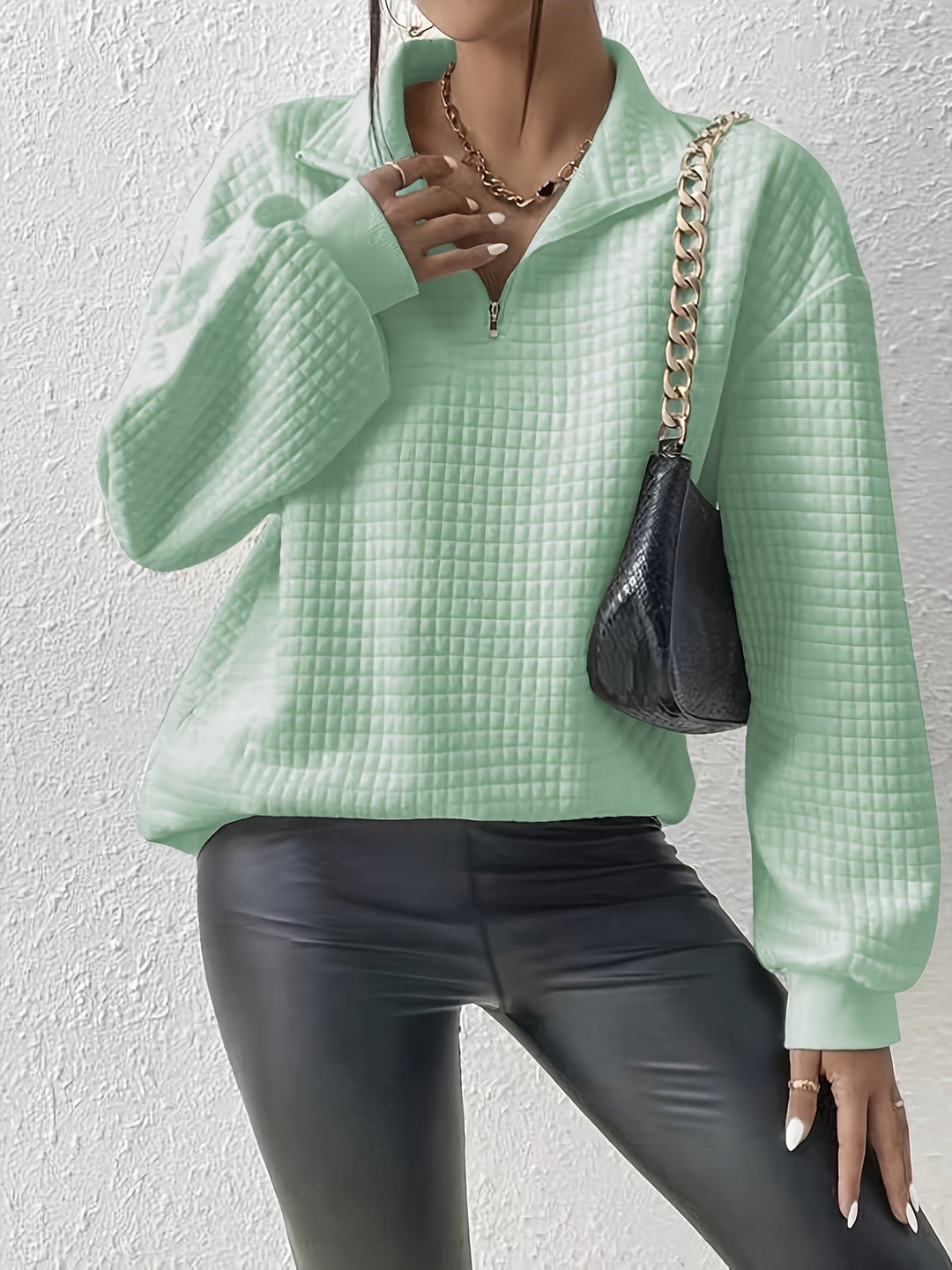 Marguerite light green textured quarter-zip pullover styled with black pants