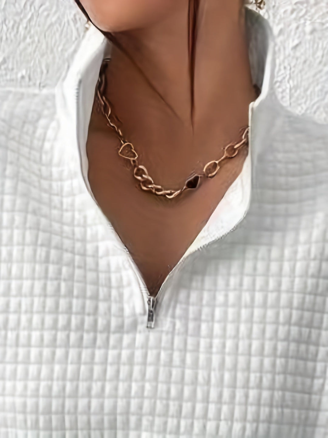 Marguerite white textured quarter-zip pullover, close-up of collar and zip