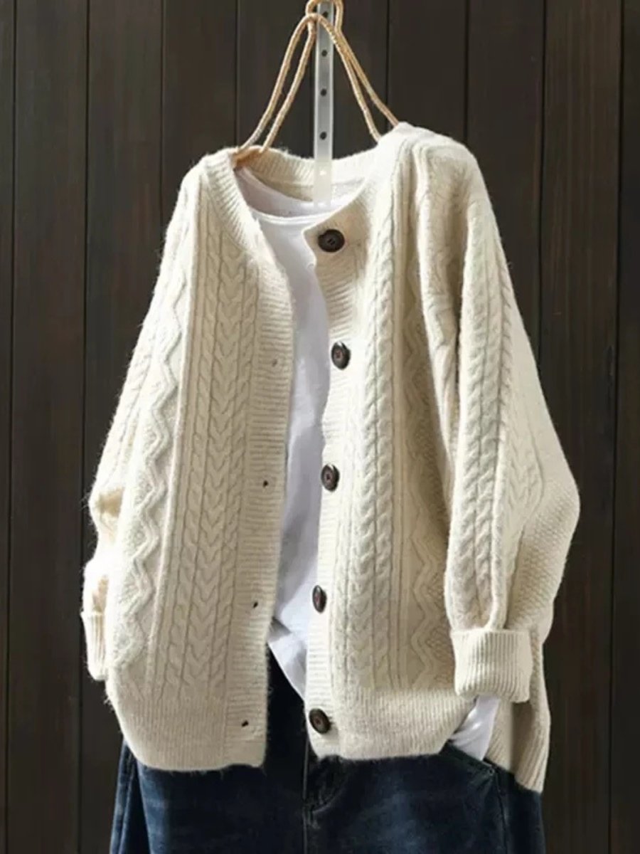 Marielle oversized cable knit button cardigan in beige, front view on hanger