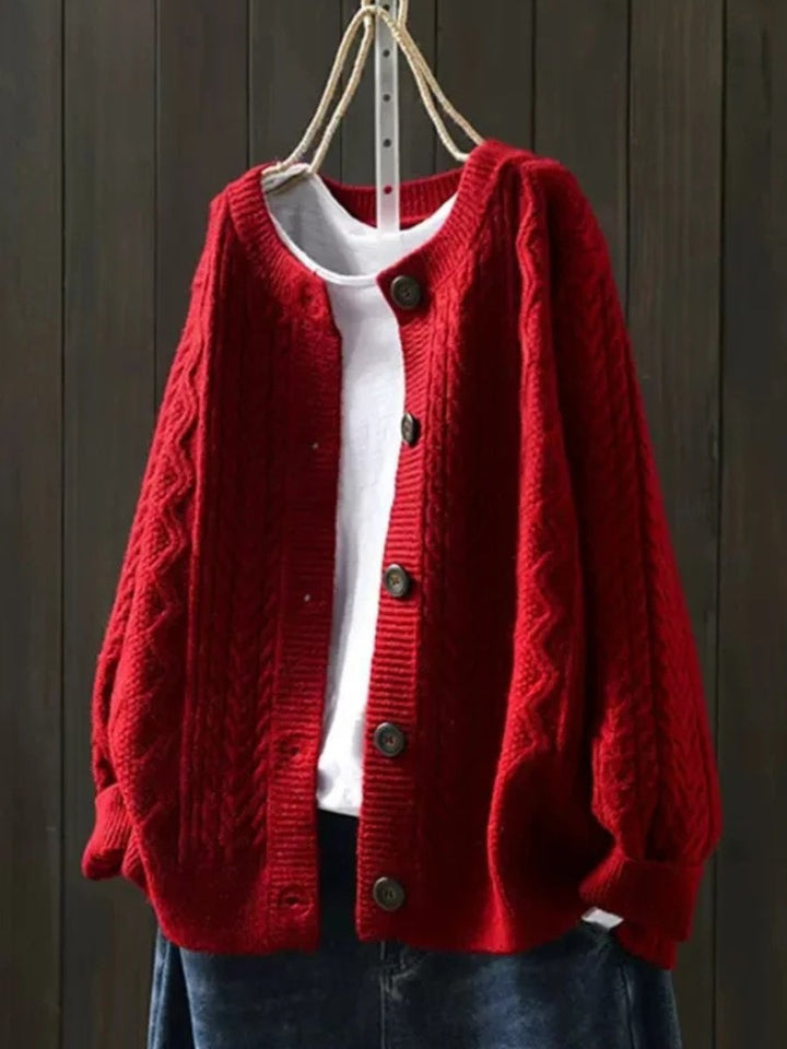 Marielle oversized cable knit button cardigan in red, front view on hanger