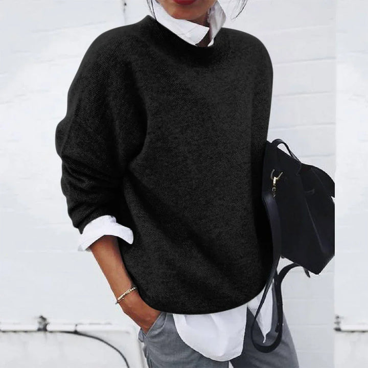 Marigold mock neck long sleeve sweater in black, styled with backpack