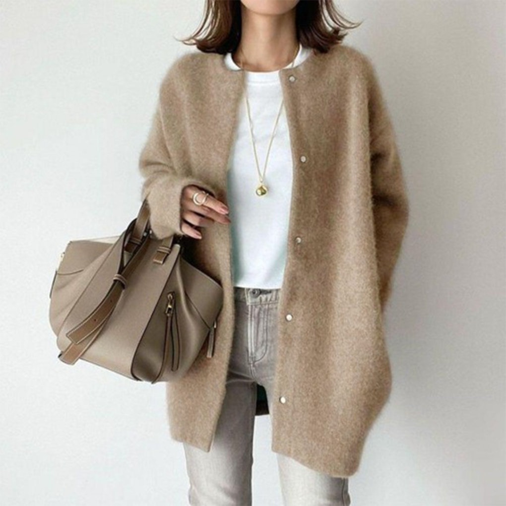 Marlowe fuzzy button down cardigan in tan, front view with handbag