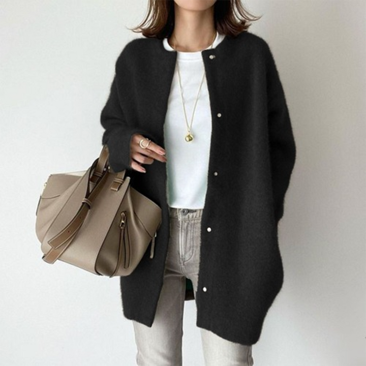 Marlowe fuzzy button down cardigan in black, front view with handbag