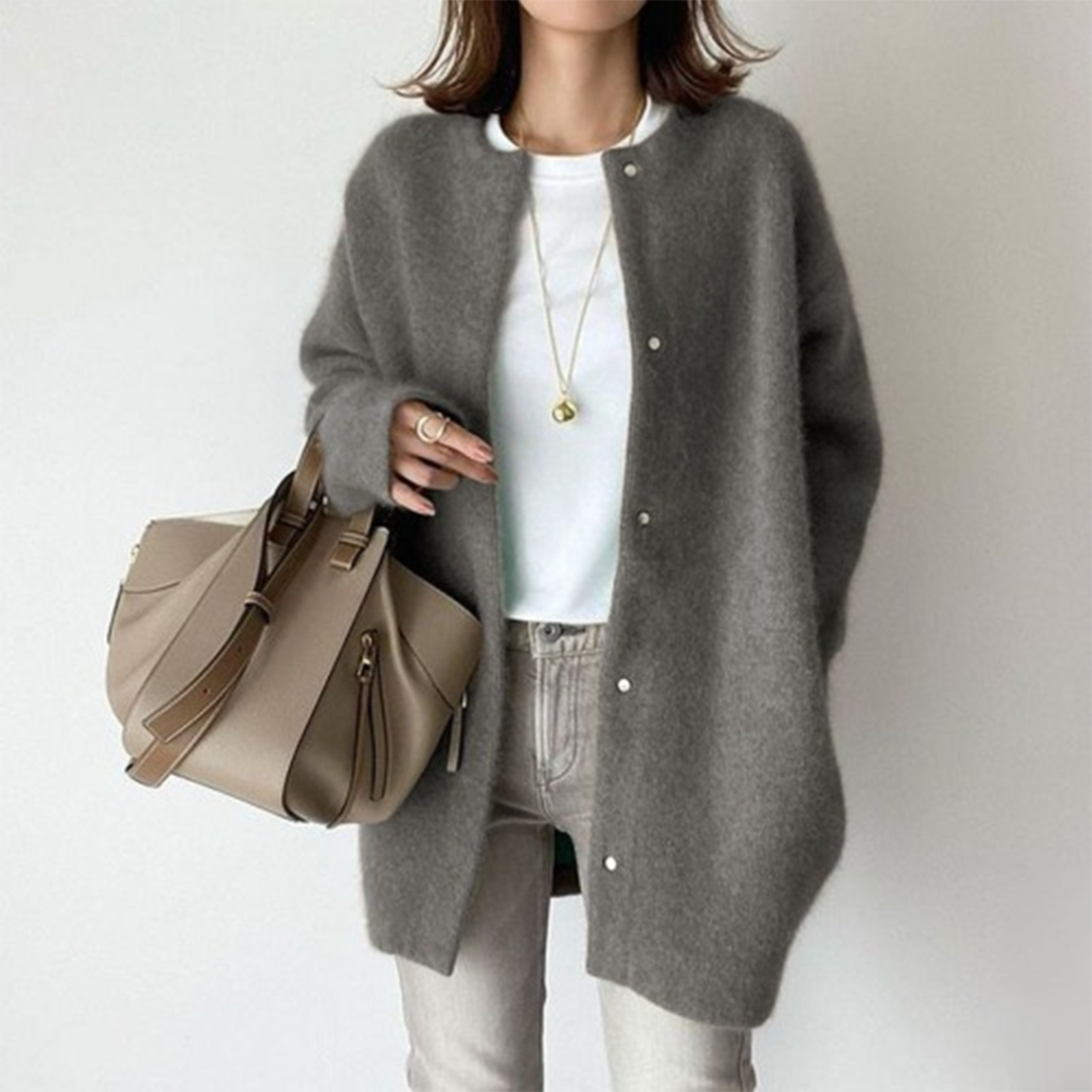 Marlowe fuzzy button down cardigan in gray, front view with handbag