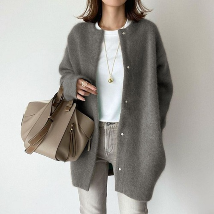 Marlowe fuzzy button down cardigan in gray, front view with handbag